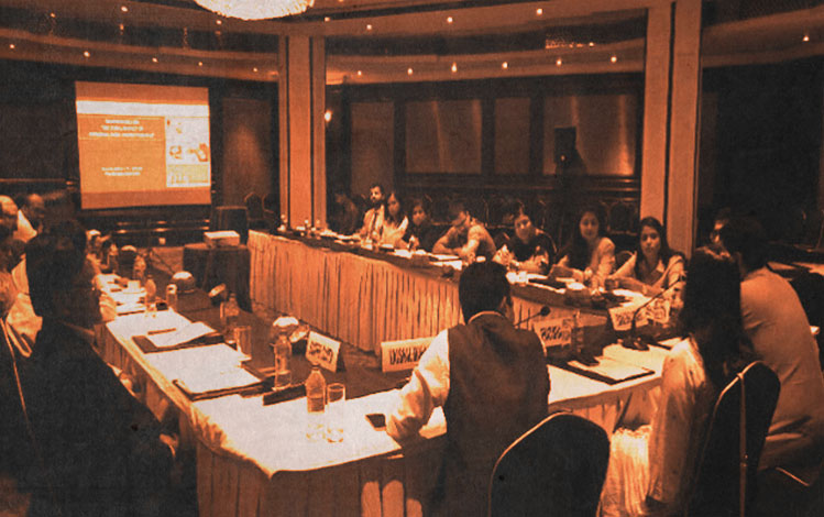 Group of people conversating at roundtable event