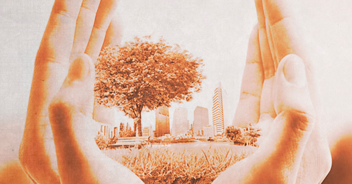Hands holding a city park 
